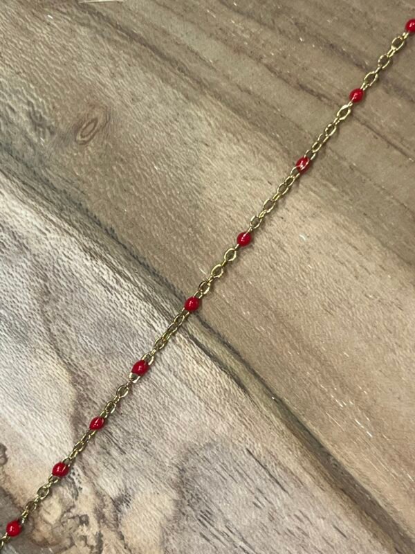 Collier doré perles rouges