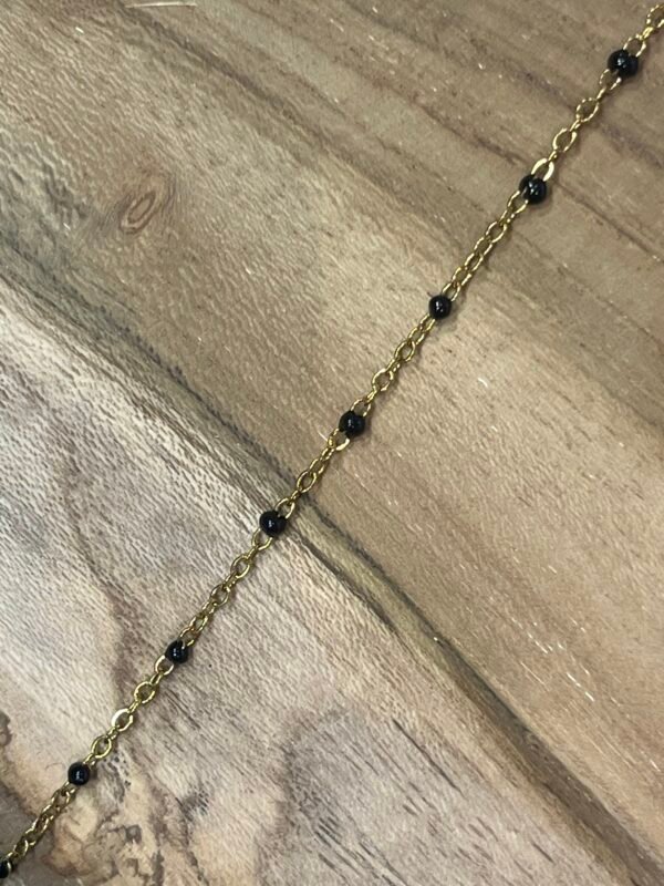 Collier doré perles noires